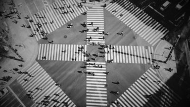 bird view of a pedestrian crossing with lots of people