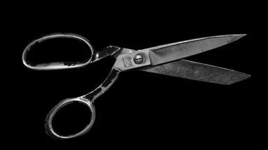 A scissor on black background