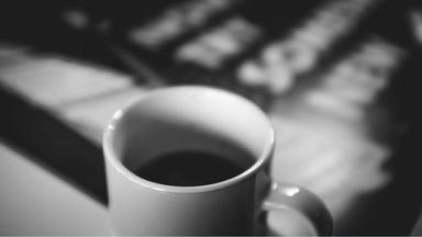 black and white photo of a coffee cup