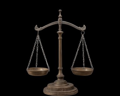 an antique brass balancing scale